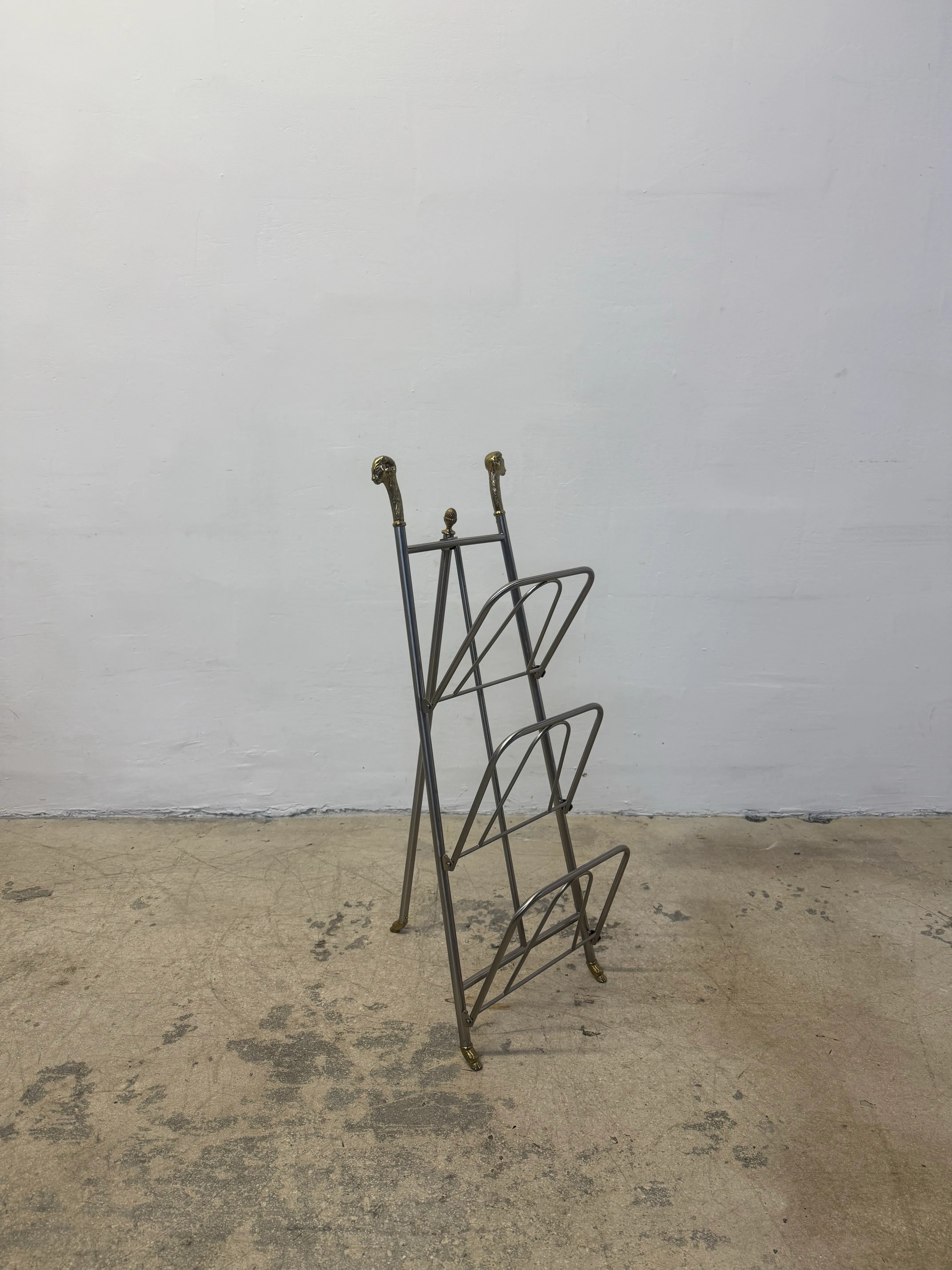 Maison Jansen Style Steel and Brass Rams Head and Feet Magazine Rack, Italy