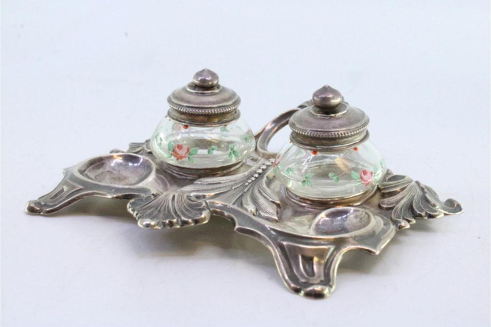 Silver Relief Inkwell with Glass Tanks, Floral Motifs and Cut-Out Feet