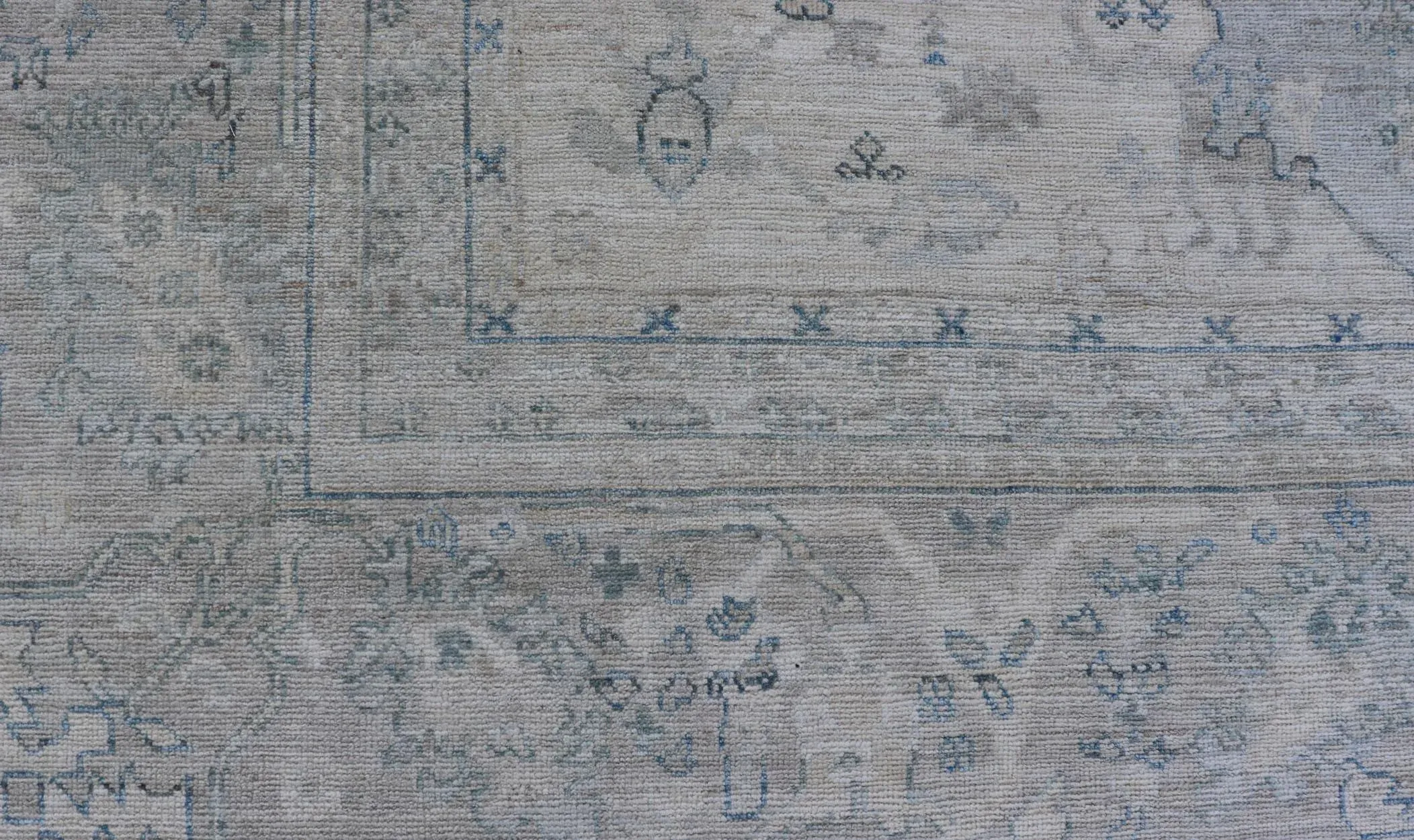 Modern Designed Rug With a Light Blue Background and Tribal Medallion Motifs