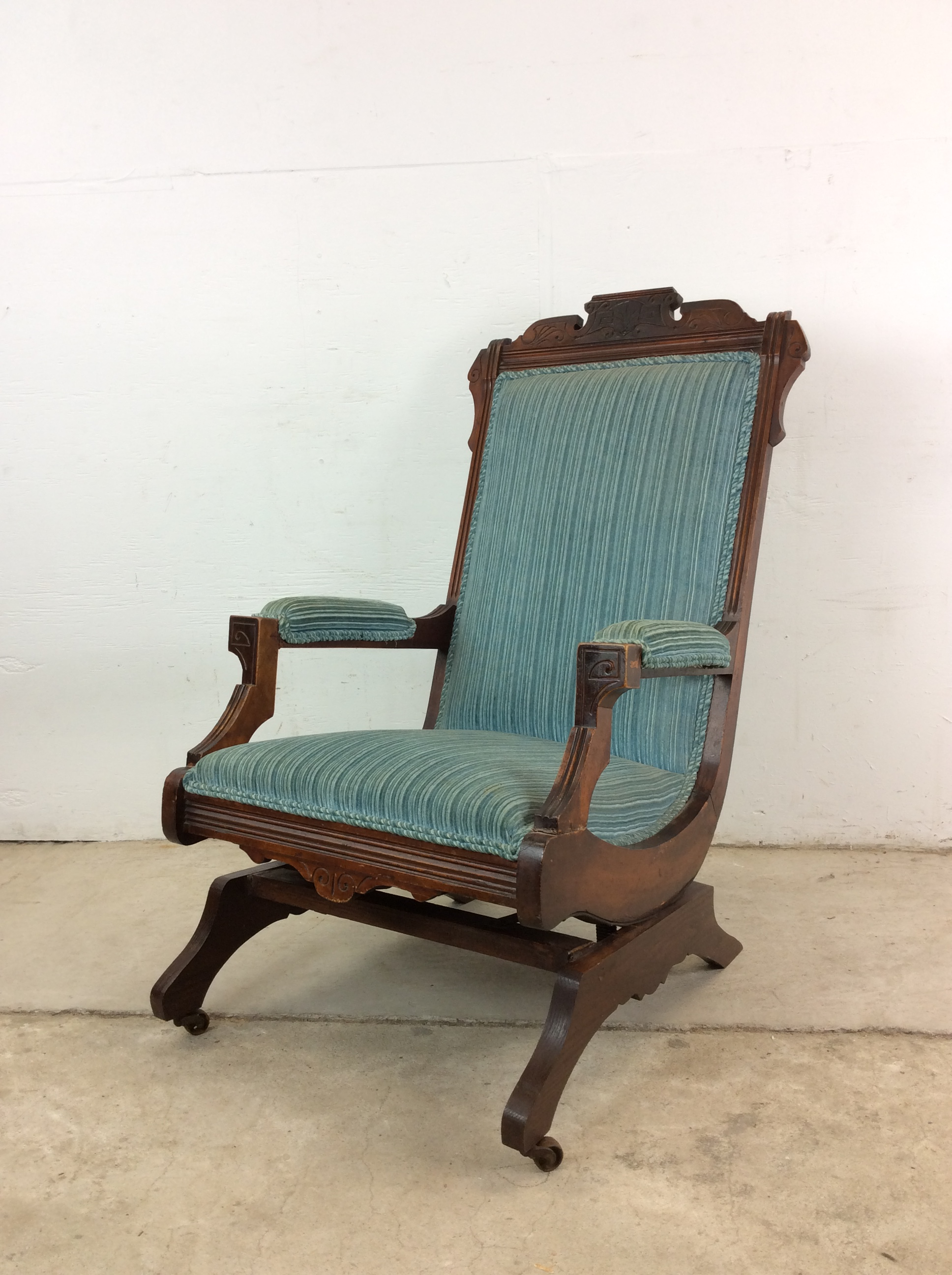 Antique Upholstered Rocking Chair With Carved Wood Detailing