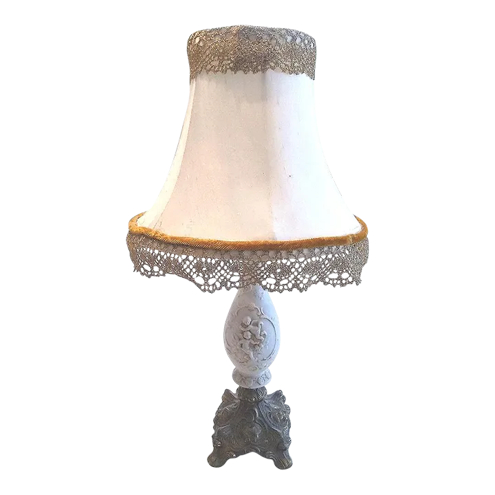 Vintage Porcelain Cherub Table Lamp With Brass Base and Fringed Shade