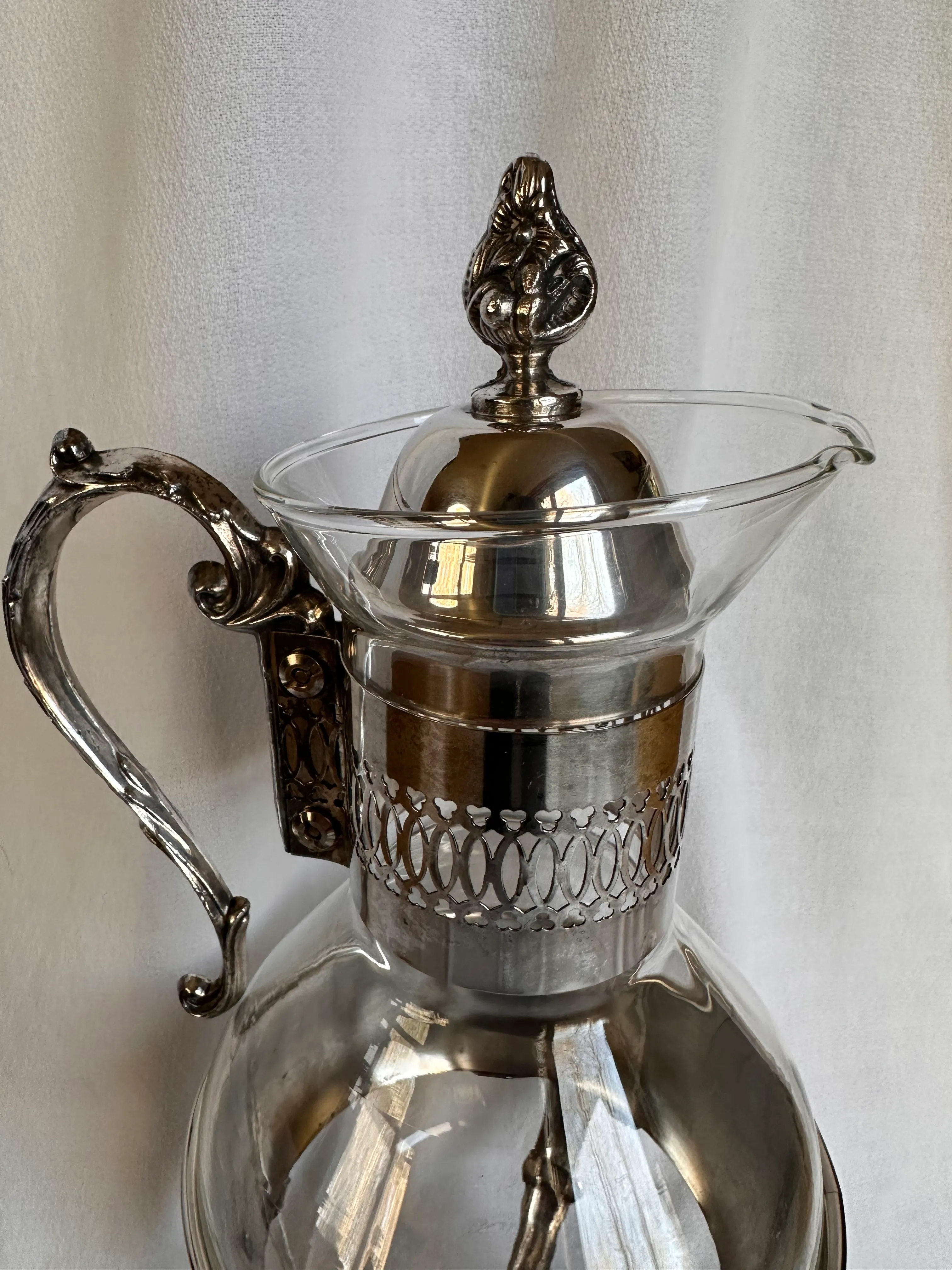 https://chairish-prod.freetls.fastly.net/image/product/master/fd76dd9c-5d3a-4dd6-8f54-f1aa309e6090/vintage-silver-plated-coffee-pot-silver-server-glass-carafe-and-pair-of-lids-5411