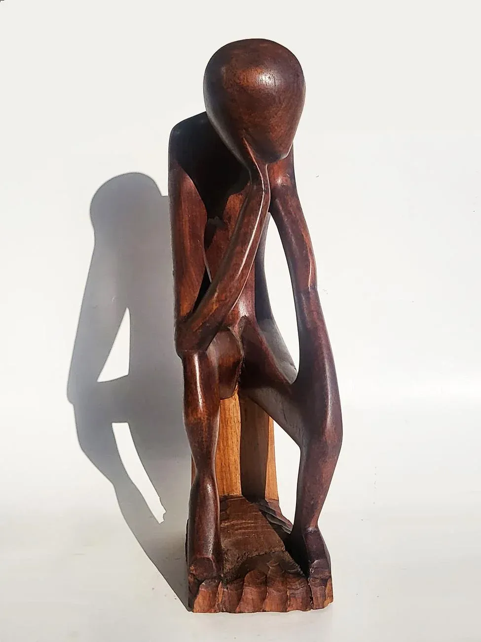 Abstract Wood Sculpture of Man Sitting Down with a Book - Thinker