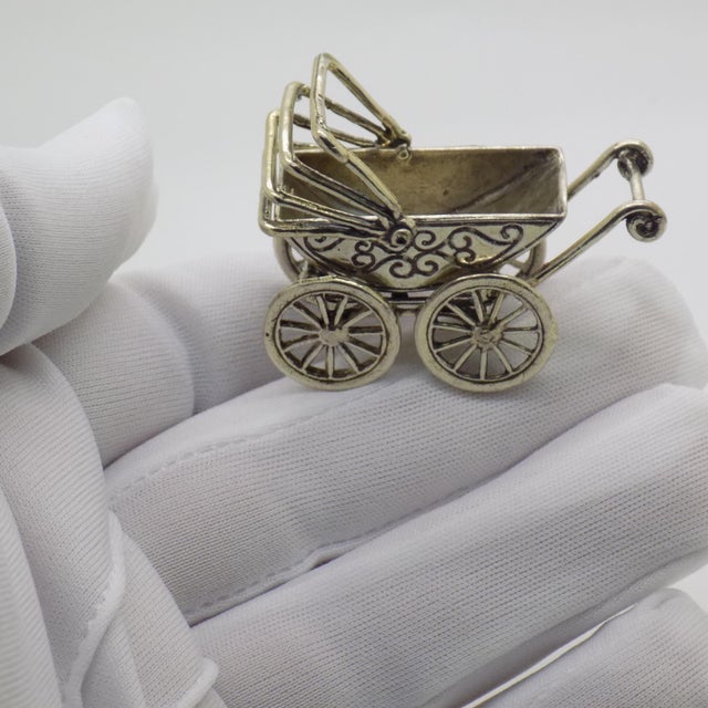This small-scale Italian miniature takes the form of a classic mid-century style baby stroller, designed with fine details...