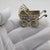 This small-scale Italian miniature takes the form of a classic mid-century style baby stroller, designed with fine details...