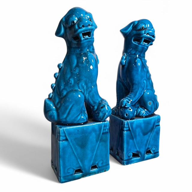 Wonderful pair of vintage Chinese turquoise glaze ceramic foo dogs. New old stock dating back to roughly the 1960's or...