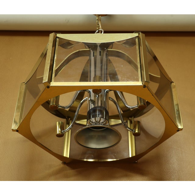 This is a mid century modern mainstay in Fredrick Raymond, although more rare than the teak and brass pieces. This chrome...