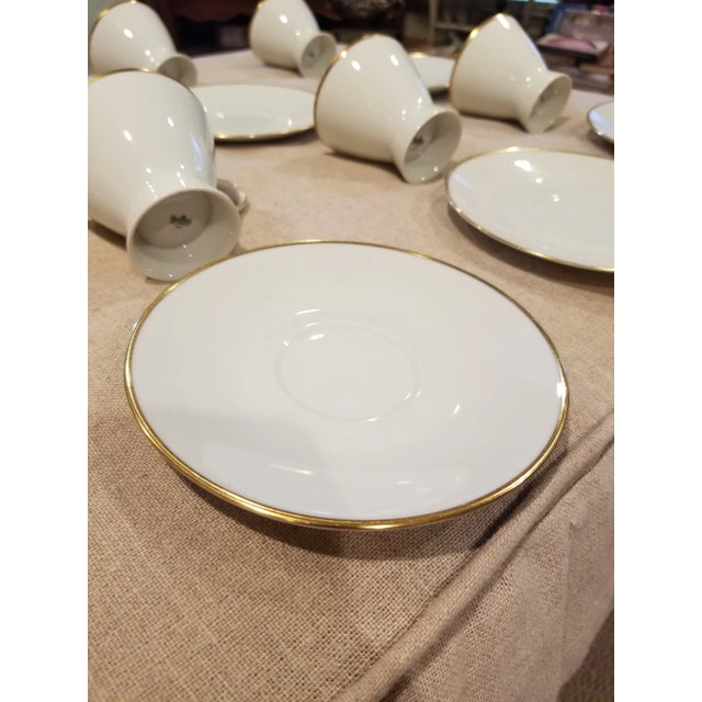 Vintage set of classic white Rosenthal porcelain cups and saucers with a gold rim. I believe that the name for the pattern...