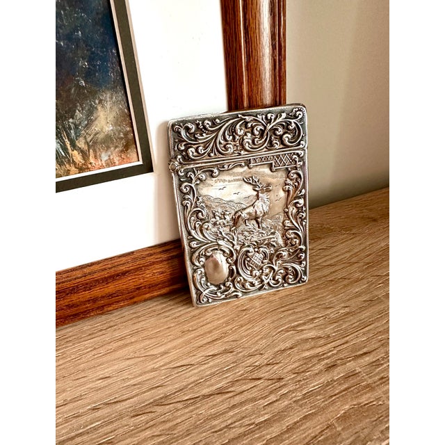 An exceptional antique Edwardian sterling silver calling card case crafted by Birmingham silversmiths Crisford & Norris,...