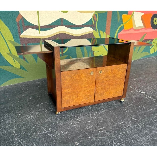 Century burl & smoked glass server/bar on casters with dropleaf on either side. In excellent condition and ready to get...