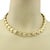 The Z Shape 14k Yellow Gold Fancy Textured Link Collar Necklace is a stylish and versatile piece of fine jewelry. This...