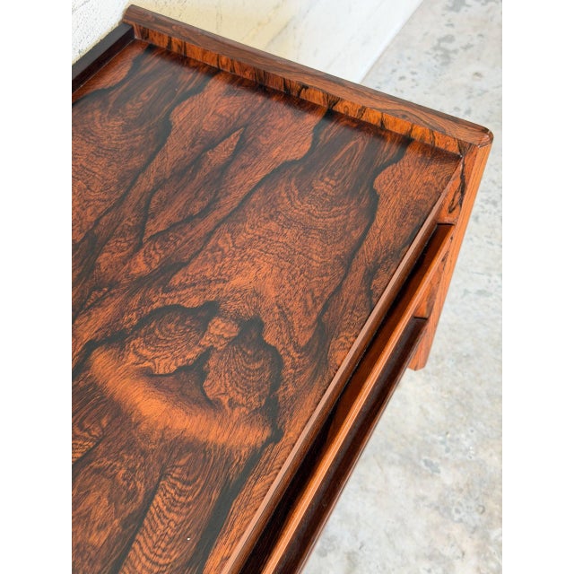 This exceptional low-profile chest displays a streamlined rectangular silhouette supported by substantial slab legs. Four...