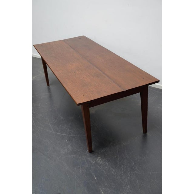 This elegant table was made in the Netherlands and Indonesia in the late 19th century. It has a tabletop made from two...