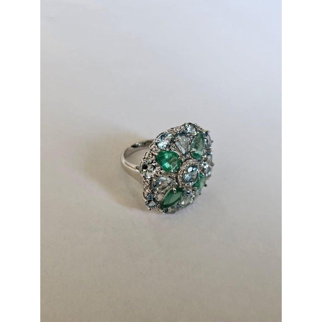 A very gorgeous and beautiful, modern style, Aquamarine & Emerald Cocktail Ring set in 18K White Gold & natural Diamonds....