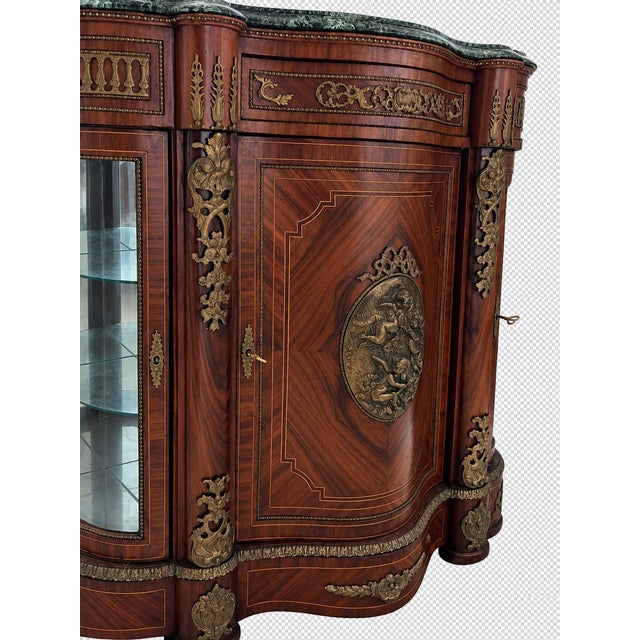 An exquisite French Louis XVI Revival-style display credenza featuring richly figured wood veneers, intricate marquetry,...