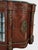 An exquisite French Louis XVI Revival-style display credenza featuring richly figured wood veneers, intricate marquetry,...