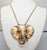 1970s goldtone matte elephant pendant with shiny edges to the earrings on a chain necklace with spring ring clasp. Marked...
