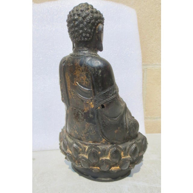 Antique Ming Bronze Seated Buddha. Classic dark bronze patina Buddha. The dimensions are 9.75" tall and 6" by 4.5"...