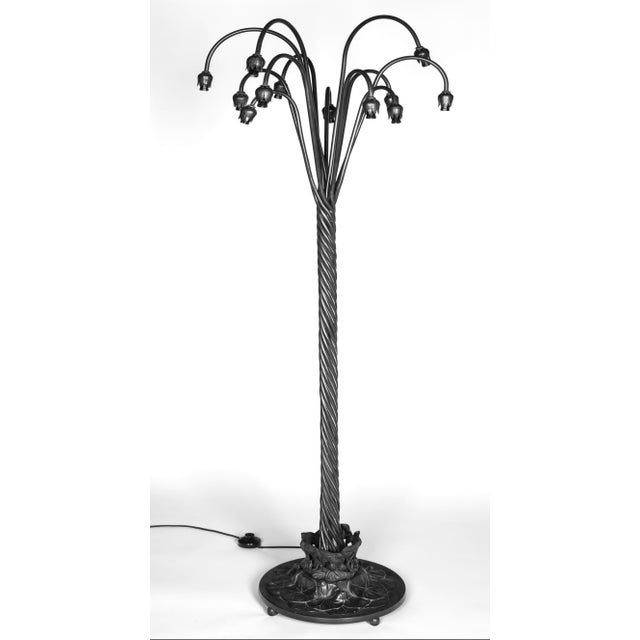 Exceptional Tiffany style bronze twelve-light floor lamp featuring hand-blown art glass shades by renowned American glass...