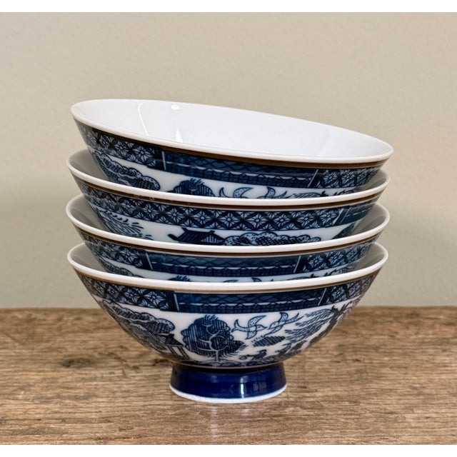 This set of four small footed bowls features a classic Chinoiserie landscape motif depicting pagodas and lush foliage in...