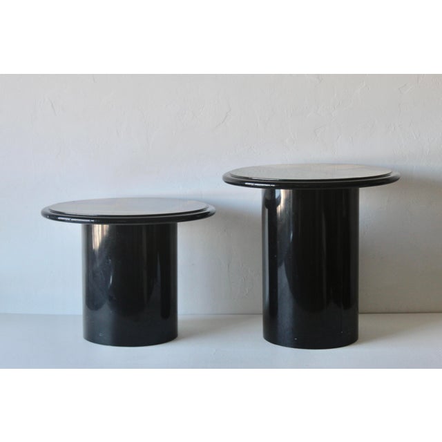 Incredible pair of postmodern mushroom side/nesting tables in the style of Milano Memphis. Both feature a black lacquered...