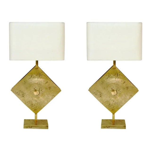 This exclusive pair of Italian sculpture custom design lamps present a very interesting Brutalist cast bronze base and...