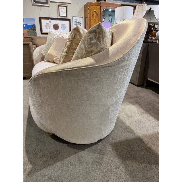 An exquisite expression of modern glamour, this Michael Amini Beige and Gold Satin Sofa showcases the designer’s signature...