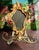 Beautiful circa 1950s Italian Florentine gold-gilded vintage mirror, wood wall decor with metal towel holder at the...