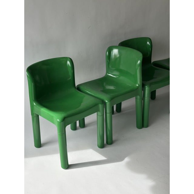 Set of four 4875 chairs designed by Carlo Bartoli for Kartell in the 1970s. Icons of Italian design, these molded plastic...