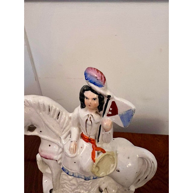 A charming antique Victorian Staffordshire pottery equestrian figure depicting Joan of Arc riding on horseback whilst...