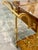 Elegant Italian bar cart crafted from richly figured burl wood with polished brass details. The design features two...