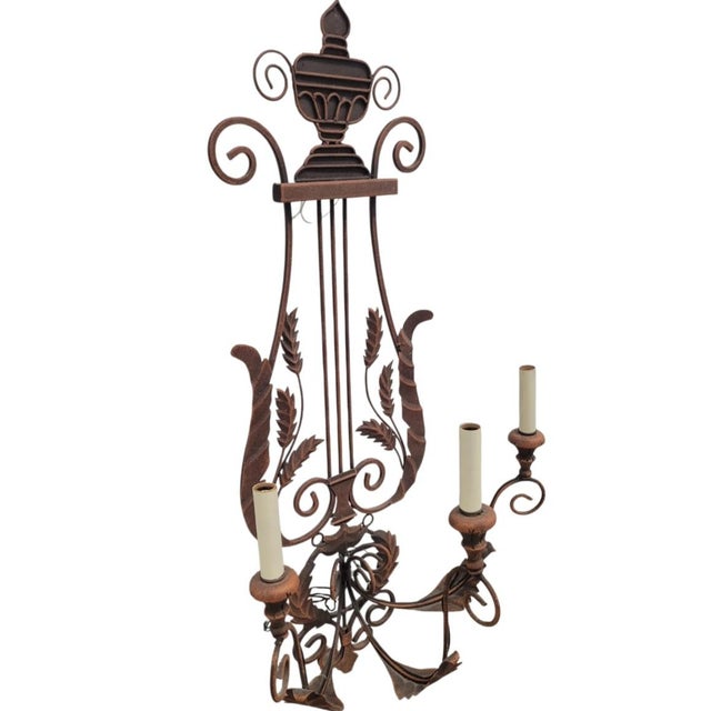 A wonderful extremely large 3ft tall iron 3 light harp or lyre hardwired wall lamp sconce. The sconce features a rusty...