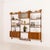This fully renovated scandinavian three-bay wall unit in teak comes from norway from the 1960s. It is a completely modular...