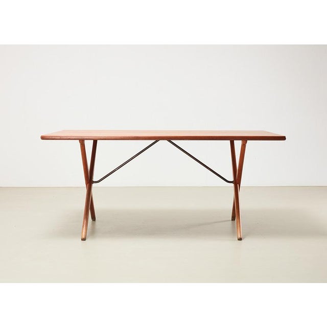 Iconic dining table, model AT-303 or Sawhorse, designed by Hans Wegner in 1955 for Andreas Tuck Denmark. The table is...