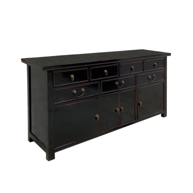 This elegant Oriental-style sideboard is in functional artistry, featuring a sleek, semi-gloss black lacquer finish that...