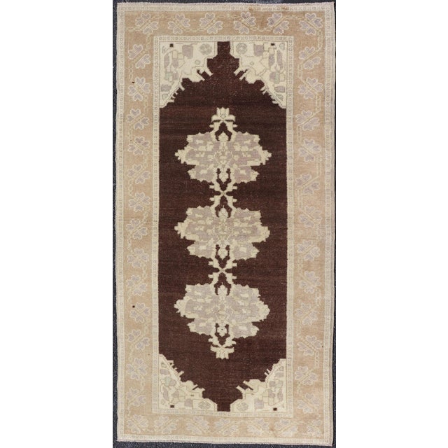 Measures: 3'0 x 6'7 Keivan Woven Arts - Brown background vintage Turkish Oushak runner with medallions in cream and ivory,...