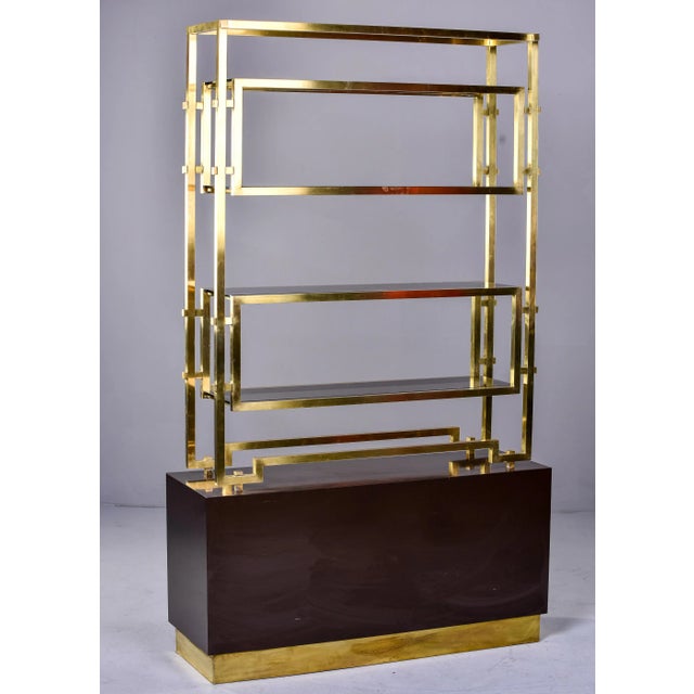 Found in Italy, this circa 1970s shelf cabinet is attributed to Romeo Rega. The base is an espresso colored enamel over...