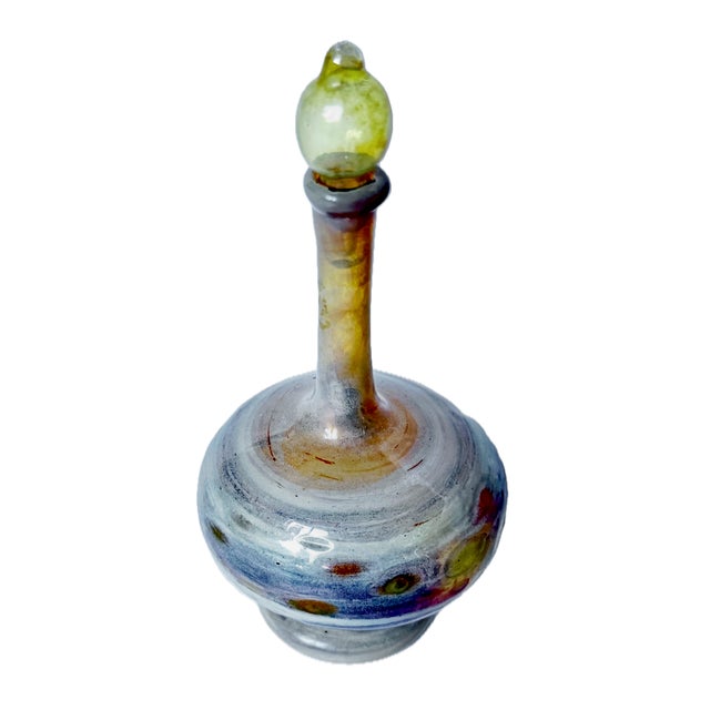 Small vintage Italian Murano blown glass "Genie" bottle with stopper. Glass is spun and blown with multiple colors in a...