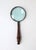 A magnifying glass in brass with a turned rich wood handle, circa late-20th century. A great piece for a desk, office,...