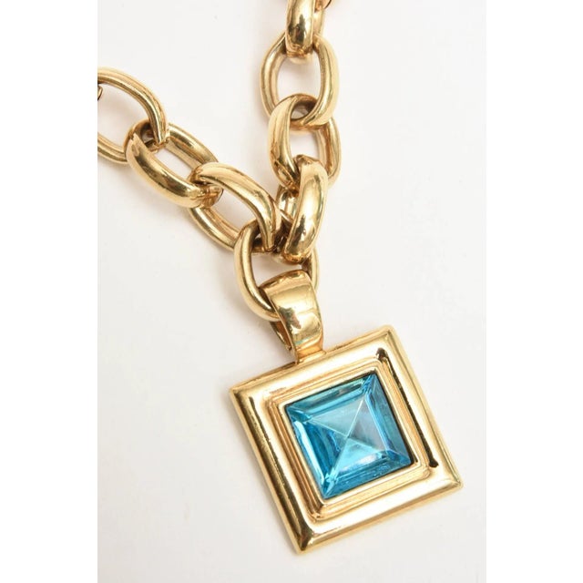 This is part of Chairish’s Costume Jewelry assortment. This substantial and heavy brass and glass gold link french signed...