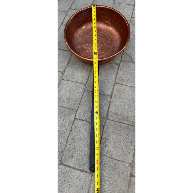 This is a handsome, rustic hand crafted hammered pan. It can be used in the kitchen or hung on a wall for decor (or both)....