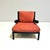 Baisity' armchair by Antonio Citterio for B&B with red fabric cushions. Metal frame covered in black leather. This piece...