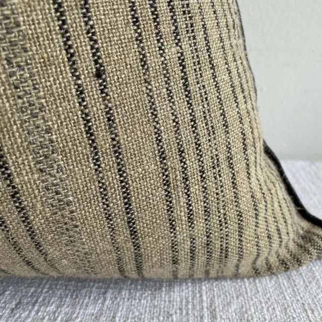 Custom linen blend accent pillow. Color: A black/ natural linen colored nubby textured style pillow with a stitched edge,...