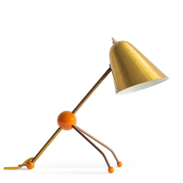 This archival photographic print highlights a Jacques Biny table lamp from the 1950s, an iconic example of mid-century...