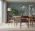 An elegant set of four chairs in golden brown teak, designed by Henning Kjærnulf for KS Møbler in Denmark. with its soft...