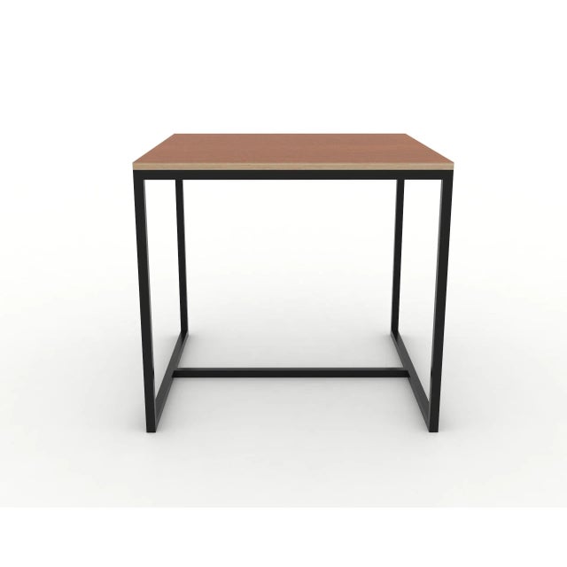This table is made of woof with a steel structure. It features a solid wood tabletop veneered with cherry on top of 22mm...