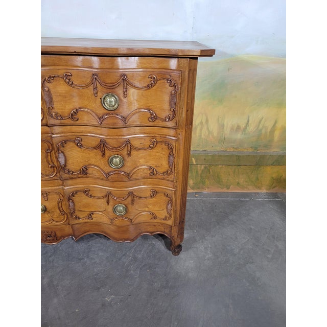 Louis xv style cherrywood commode with bow-shaped front an elegant cherrywood commode with a bow-shaped front, featuring...