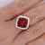 VIntage Spessartine Garnet and Diamond Ring. This vintage ring features a GIA-certified, vivid cushion-cut spessartine...