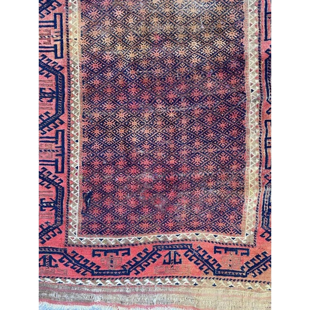 Beautiful late 19th century Baluch rug with a tribal and geometrical design and nice natural colors, entirely hand knotted...