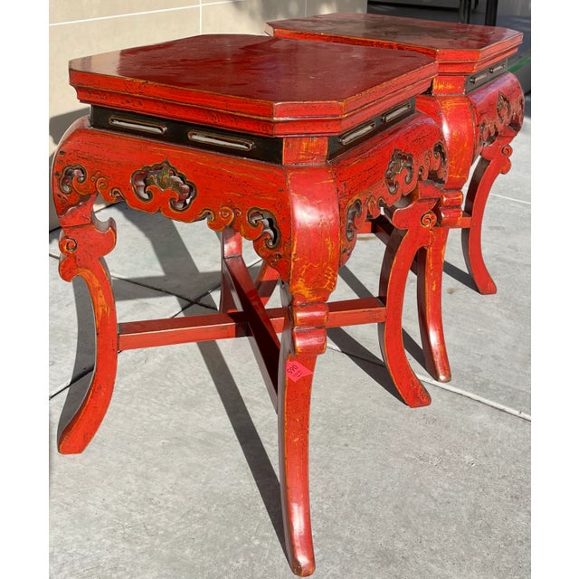 Exquisite pair of rare Fijian side tables. The color of these tables is very nearly a Diana Vreeland red and would...